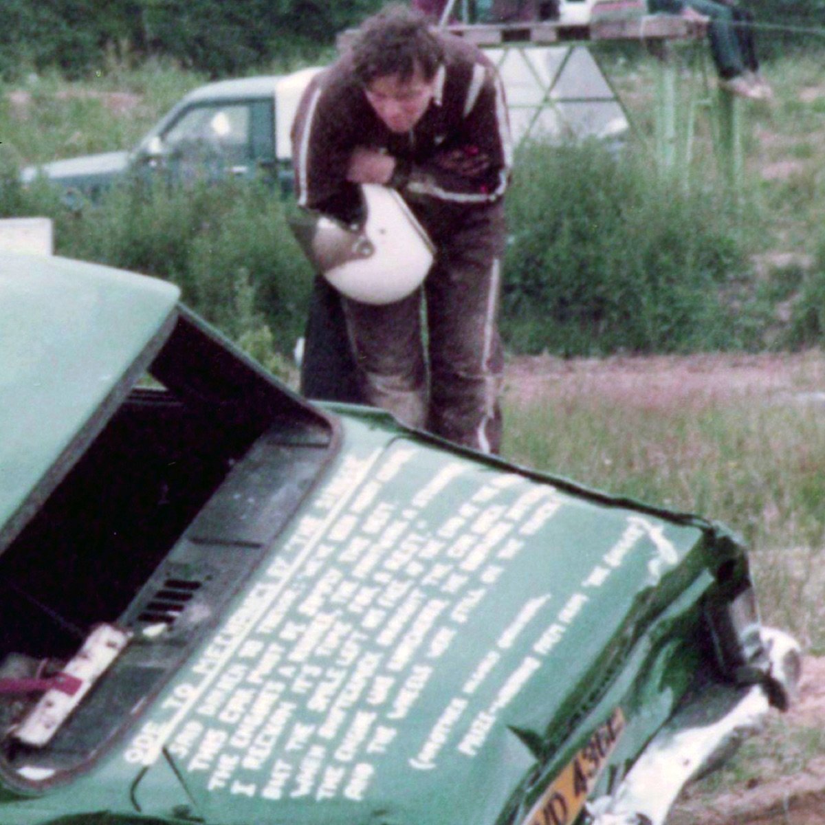Mike inspecting damage to his banger racing car