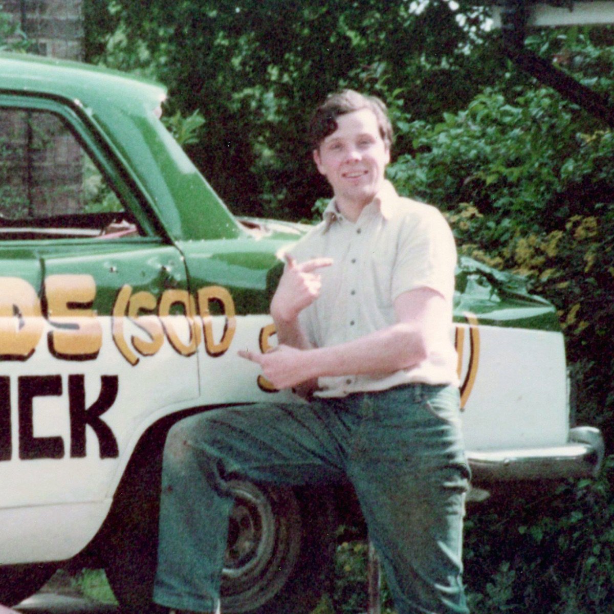 Mike standing beside his banger racing car